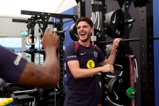 Declan Rice laughs in the gym while on England duty