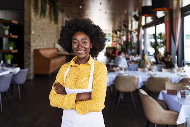  Female business owner in restaurant