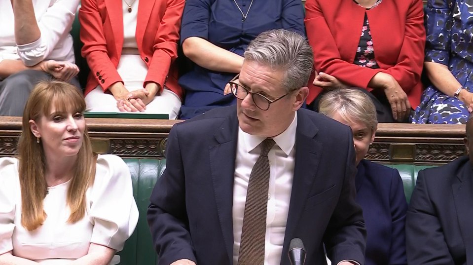 Sir Keir Starmer leads his Labour MPs onto the government benches