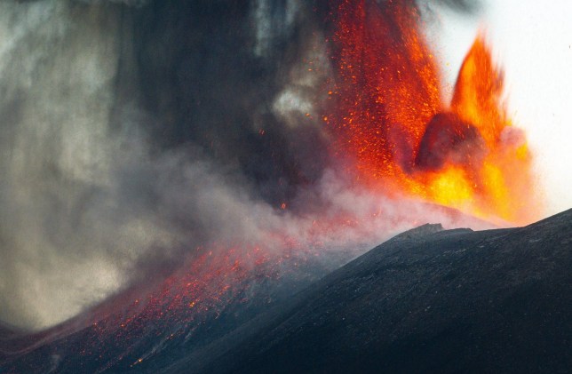 Mount Etna spewing lava and ash into the air