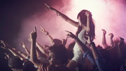 Getty Images A crowd dancing at a concert