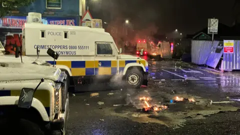 PSNI land rovers in Sandy Row