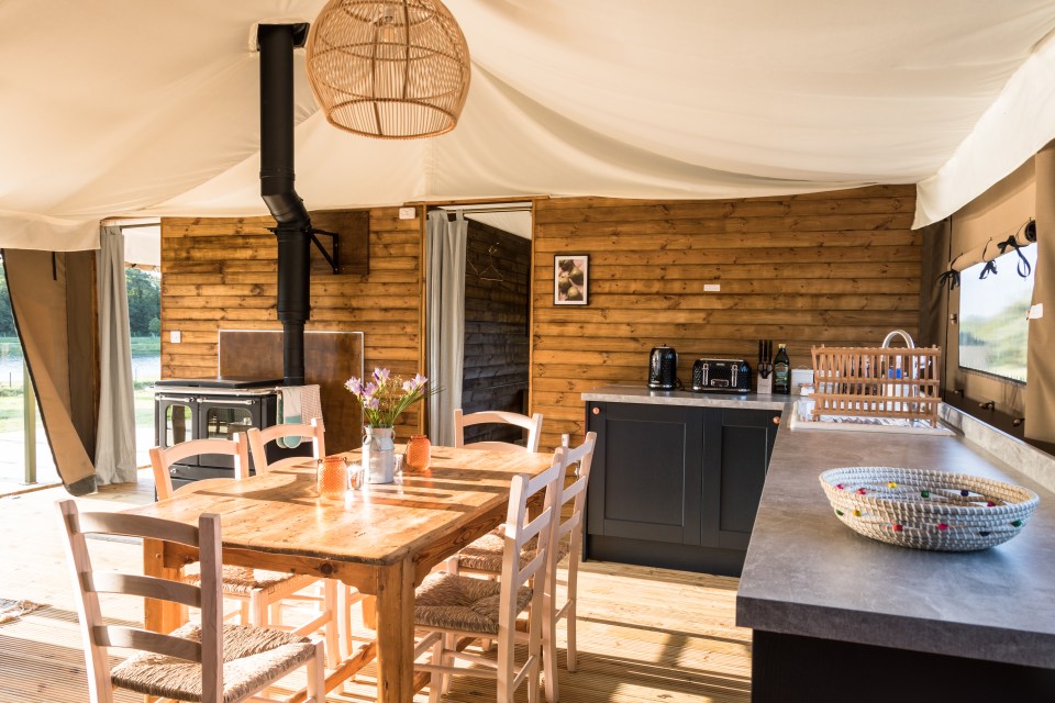 The stunning kitchen has a wood-burning stove