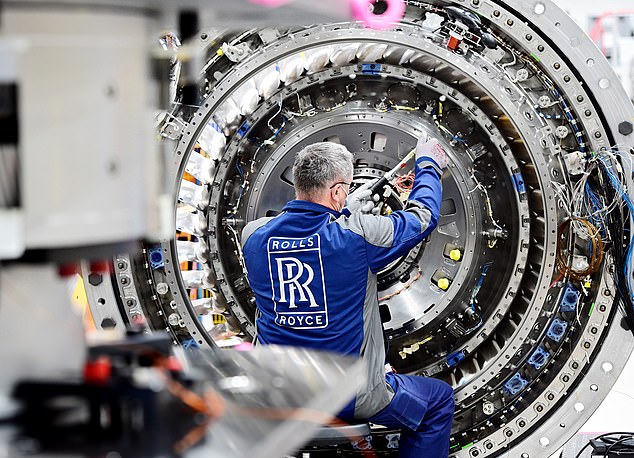 A technician at work on the UltraFan, an engine that Rolls-Royce hopes will be behind the next generation of super-efficient aircraft