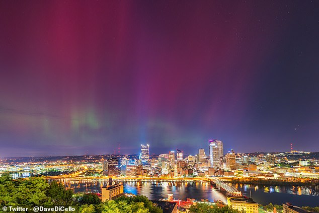 Over Pittsburgh (pictured), despite bright light pollution one photographer was able to capture the Northern Lights in the early morning