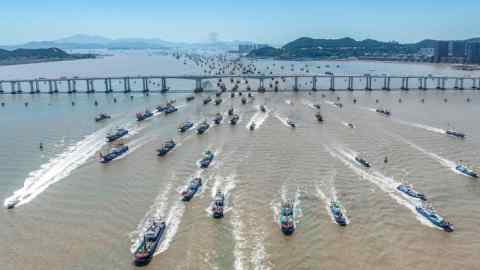 aerial view of fishing boats heading out to sea in Zhoushan, in eastern China’s Zhejiang province