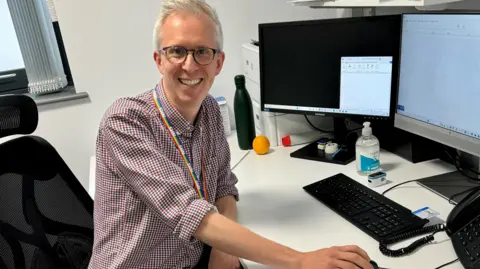 Other Dr Tom Gorman at his desk