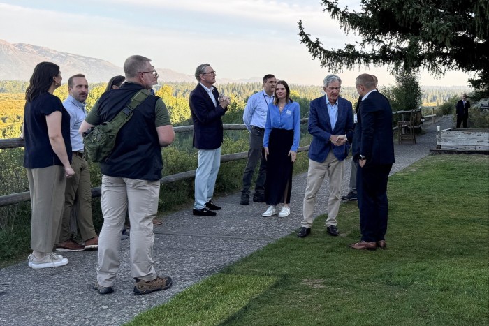 Federal Reserve chair Jerome Powell with a group of people