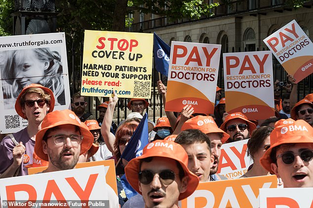 Junior doctors take part in a rally outside Downing Street in June. They have now each been handed a £177,000 pension boost thanks to the Government's pay deal