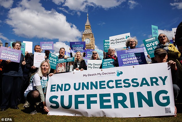 Campaigners for assisted dying gather outside Parliament with a banner reading 'end unnecessary suffering' in April this year