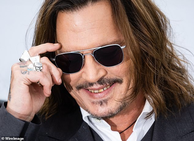 Depp was pictured in May of 2023 smiling, attracting attention amid a number of oral imperfections, including teeth that did not match in color and appeared to have damage