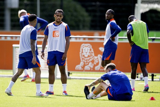 Wout Weghorst sits on the ground after dueling with Jurrien Timber during a training session of the Dutch national team at the KNVB Campus on Sept. 8, 2024 in Zeist, Netherlands. The Dutch national team prepares for the UEFA Nations League game against Germany. Training Session The Netherlands