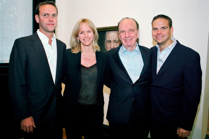 James, Elisabeth, Rupert and Lachlan stand with their arms round each others waists