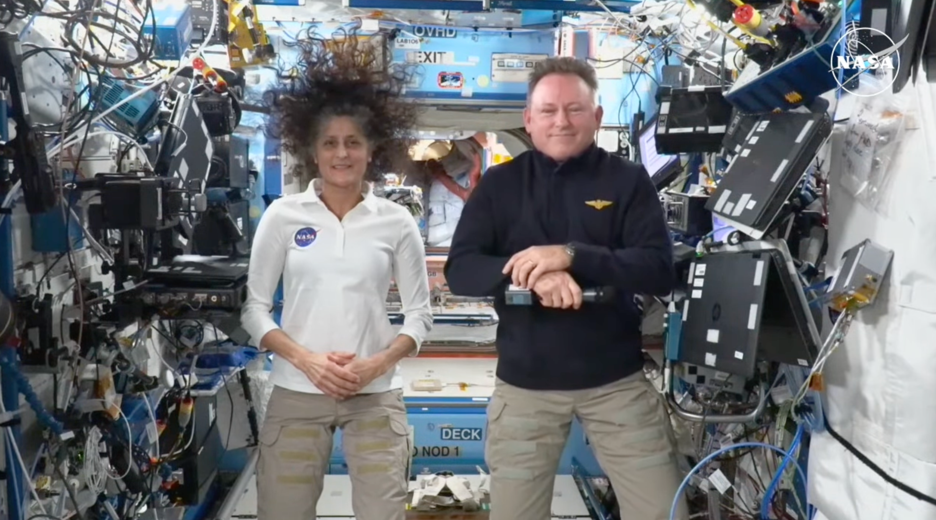 NASA astronauts Sunisa “Suni” Williams and Barry “Butch” Wilmore smile next to each other as the International Space Station orbits the Earth in Low Earth Orbit on Friday. The pair will be voting in the 2024 presidential election from the orbiting laboratory.