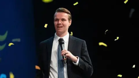 Getty Images Josh Reynolds on stage at Lib Dem conference