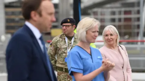 Getty Images Photograph of Ruth May alongside Matt Hancock and Nadine Dorries in April 2020.