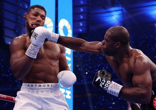 Daniel Dubois punches Anthony Joshua in the first round of their the IBF World Heavyweight Title fight at the Riyadh Season