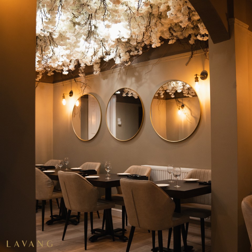 The restaurant's has a chic interior, with white blossom on the ceiling