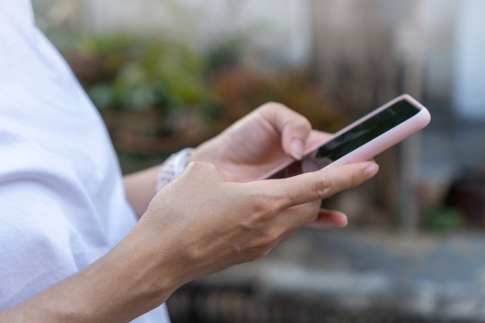 Woman holding a smartphone