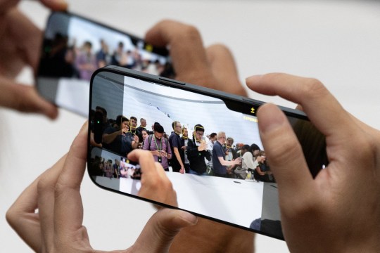 Attendees try the new iPhone 16 as Apple holds an event at the Steve Jobs Theater on its campus in Cupertino, California