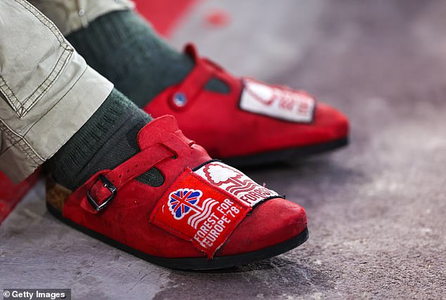 Nice result: A Nottingham Forest fan wearing red Birkenstock shoes at a Carabao Cup match (pictured). The German shoemaker celebrates its 250th anniversary this year