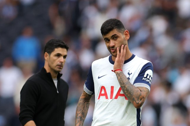  Christian Romero of Tottenham Hotspur reacts ahead of Mikel Arteta, Manager of Arsenal during the Premier League match between Tottenham Hotspur FC and Arsenal 