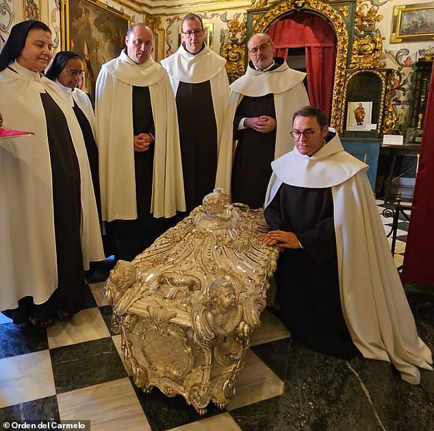 The Diocese of Avila in Spain unlocked a medieval saint's tomb to conduct an analysis on the 450-year-old remains. Pictured: The silver coffin encased in marble of Saint Teresa of Avila