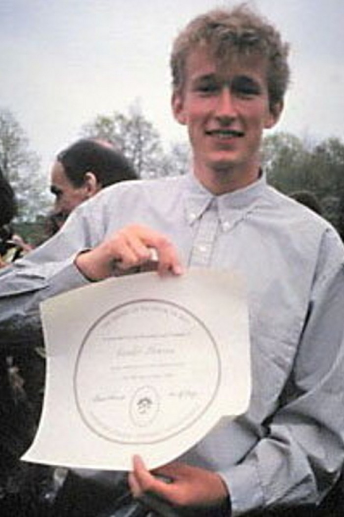 Sander Thoenes with his diploma on Commencement Day at Hampshire College