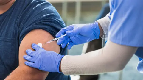 Getty Images A man being vaccinated