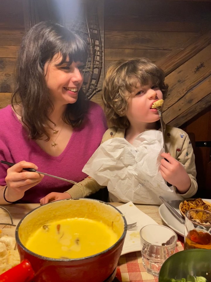 Caroline McGuire and her son enjoy a typical fondue