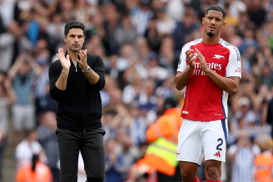 Mikel Arteta, Manager of Arsenal and William Saliba of Arsenal applauds the fans after the Premier League match between Arsenal FC and Brighton & Hove Albion FC at Emirates Stadium on August 31, 2024 in London, England