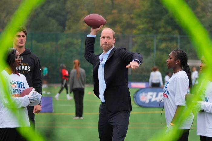 Prince William played the role of quarterback, hurling the ball to a team-mate