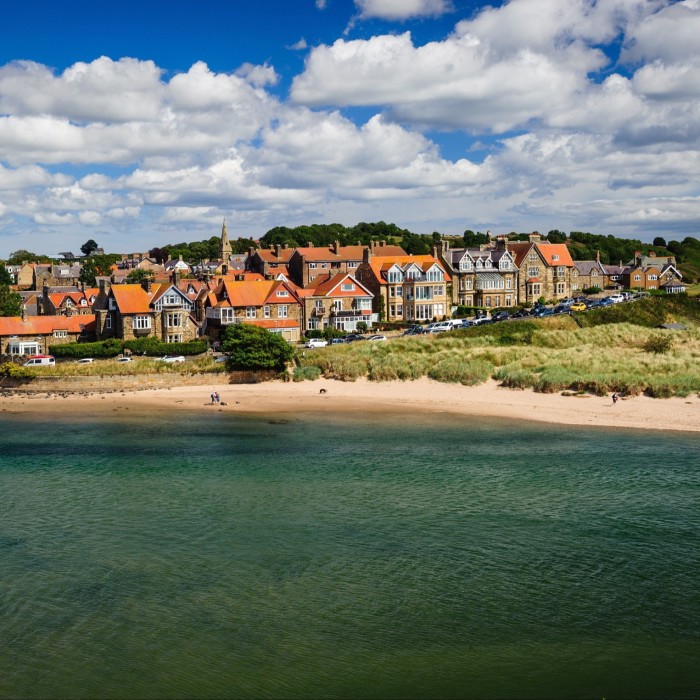 A coastal village on a sunny day with a bright blue sky