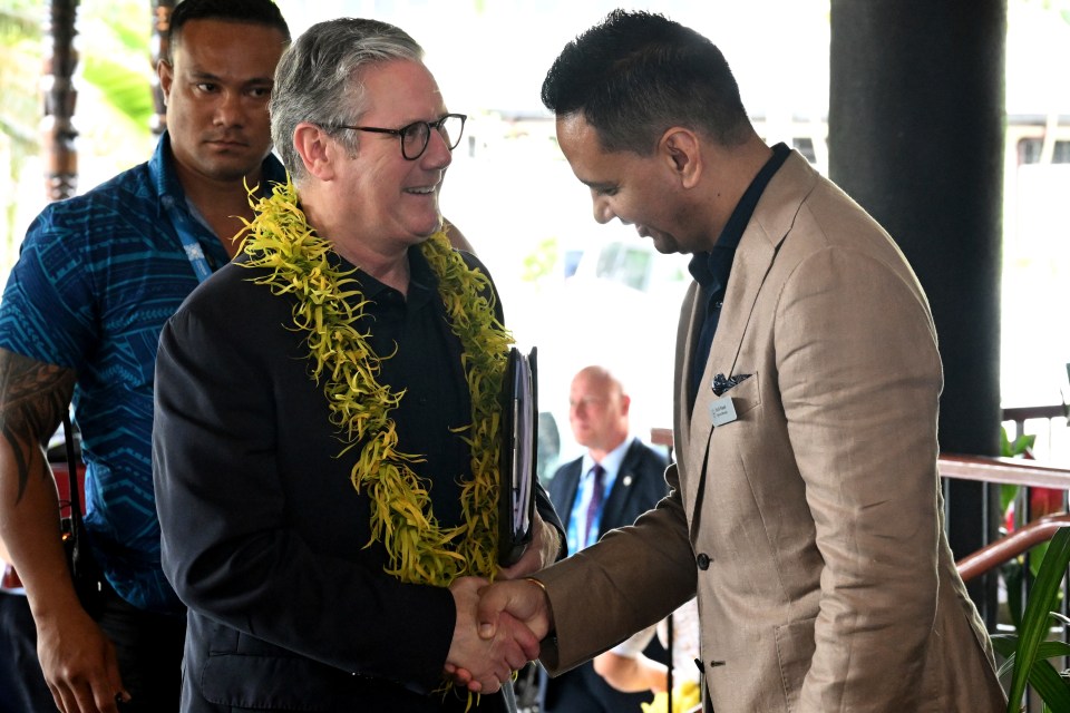 The Labour leader is greeted by the Sheraton general manager Sunil Rawat as he arrives for the Leaders' Retreat