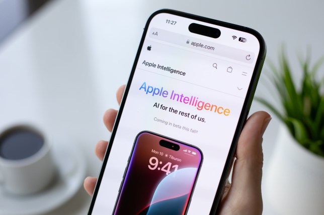 Woman holding an iPhone with Apple Intelligence information on the screen