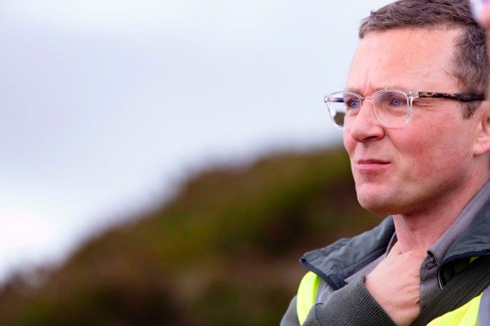 Roderick MacLoed stands outdoors near Loch Ness, Scotland. 