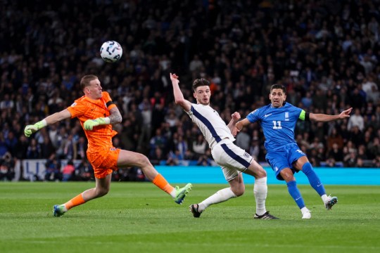 asos Bakasetas of Greece chips Jordan Pickford of England before team-mate Levi Colwill clears off the line during the UEFA Nations League 2024/25 League B Group B2 match between England and Greece