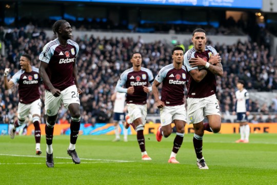 Morgan Rogers of Aston Villa celebrates after scoring his side's first a goal during the Premier League match between Tottenham Hotspur FC and Aston Villa FC