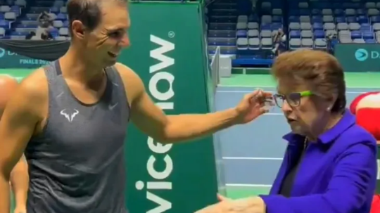 Rafael Nadal is seen smiling as he speaks to Billie Jean King