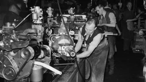 Getty Images Factory workers in the engine production line at the Vauxhall car plant, Luton, Bedfordshire, February 4th 1954.