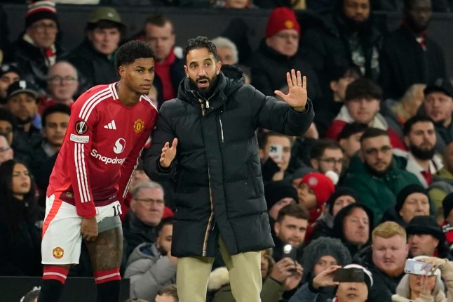 Manchester United's head coach Ruben Amorim, right, gives instructions to Manchester United's Marcus Rashford during the Europa League opening phase soccer match between Manchester United and Bodo Glimt, at the Old Trafford stadium in Manchester, England, Thursday, Nov. 28, 2024. (AP Photo/Dave Thompson)