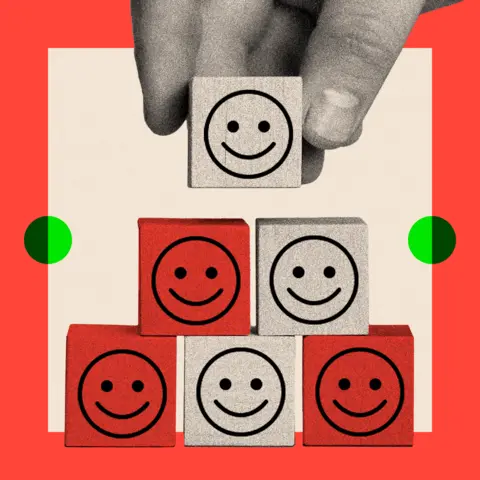 BBC A treated image shows a tower of wooden blocks with smiley faces on them