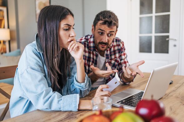 An adult couple sitting at the table