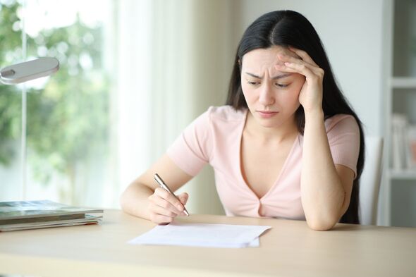 Worried Asian woman reading contract