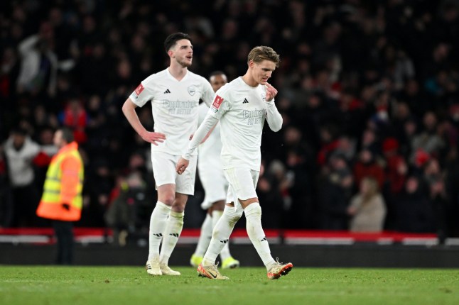 LONDON, ENGLAND - JANUARY 07: Martin Odegaard of Arsenal looks dejected after teammate Jakub Kiwior (not pictured) scores an own goal, resulting in Liverpool's first goal, during the Emirates FA Cup Third Round match between Arsenal and Liverpool at Emirates Stadium on January 07, 2024 in London, England. Arsenal wear an all-white kit at home, for the first time in the club's history, in support of the 'No More Red' campaign against knife crime and youth violence. (Photo by Shaun Botterill/Getty Images)