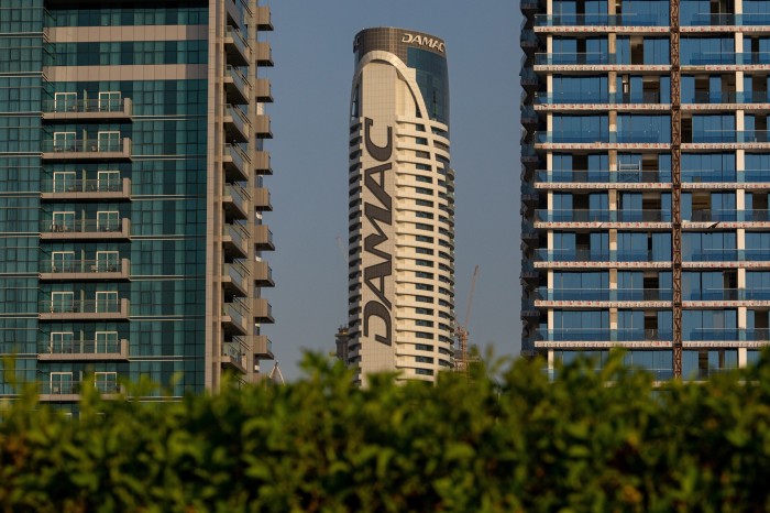 The logo of Damac Properties Dubai Co. sits on display in the Business Bay district in Dubai, United Arab Emirates