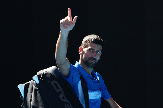 MELBOURNE, AUSTRALIA - JANUARY 24: Novak Djokovic of Serbia acknowledges the crowd as he leaves the court after retiring from the Men's Singles Semifinal against Alexander Zverev of Germany during day 13 of the 2025 Australian Open at Melbourne Park on January 24, 2025 in Melbourne, Australia. (Photo by Graham Denholm/Getty Images)