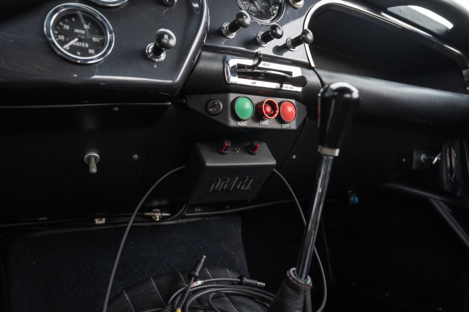 Aston Martin DB4 GT Continuation interior details, showing controls and gauges.