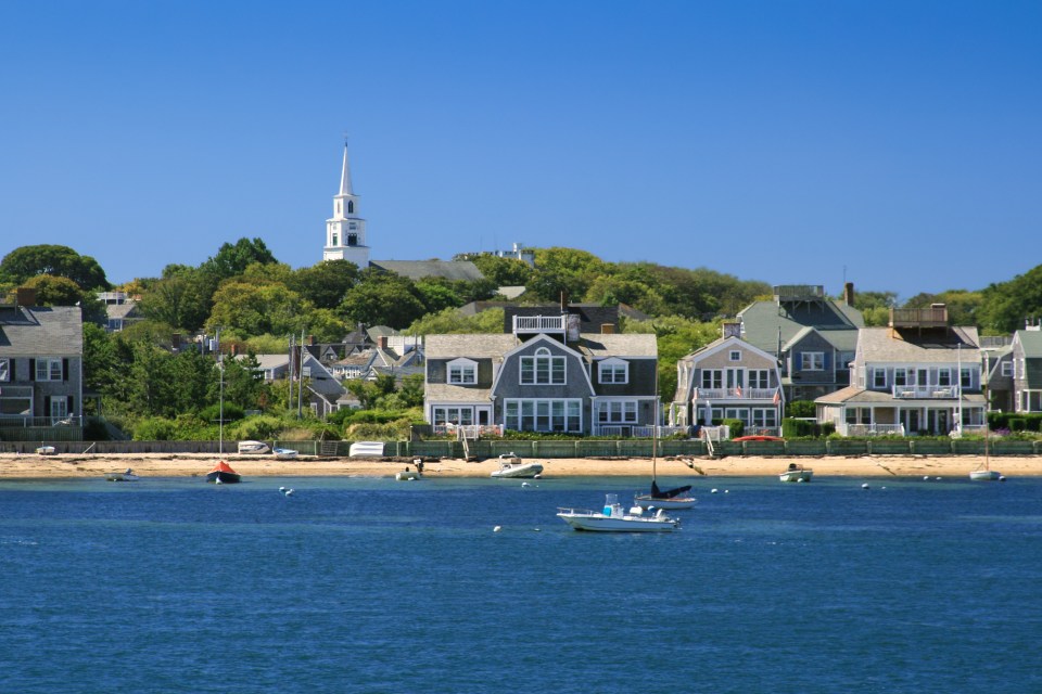 Harbor view with boats and waterfront houses.