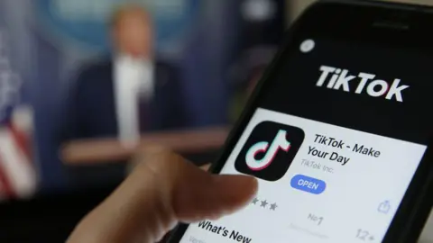 Getty Images TikTok app and President Trump giving a speech at the White House in a composite image